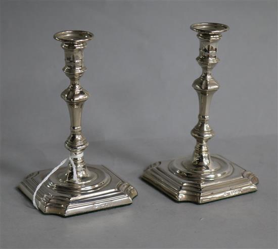 A pair of late Victorian silver tapersticks, Thomas Bradbury & Sons, London, 1895, weighted.